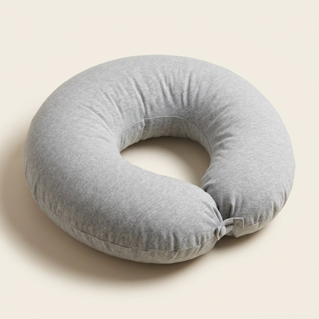 Le coussin refermé en anneau pour l'allaitement